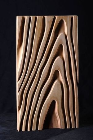 Wooden sculpture with wavy patterns